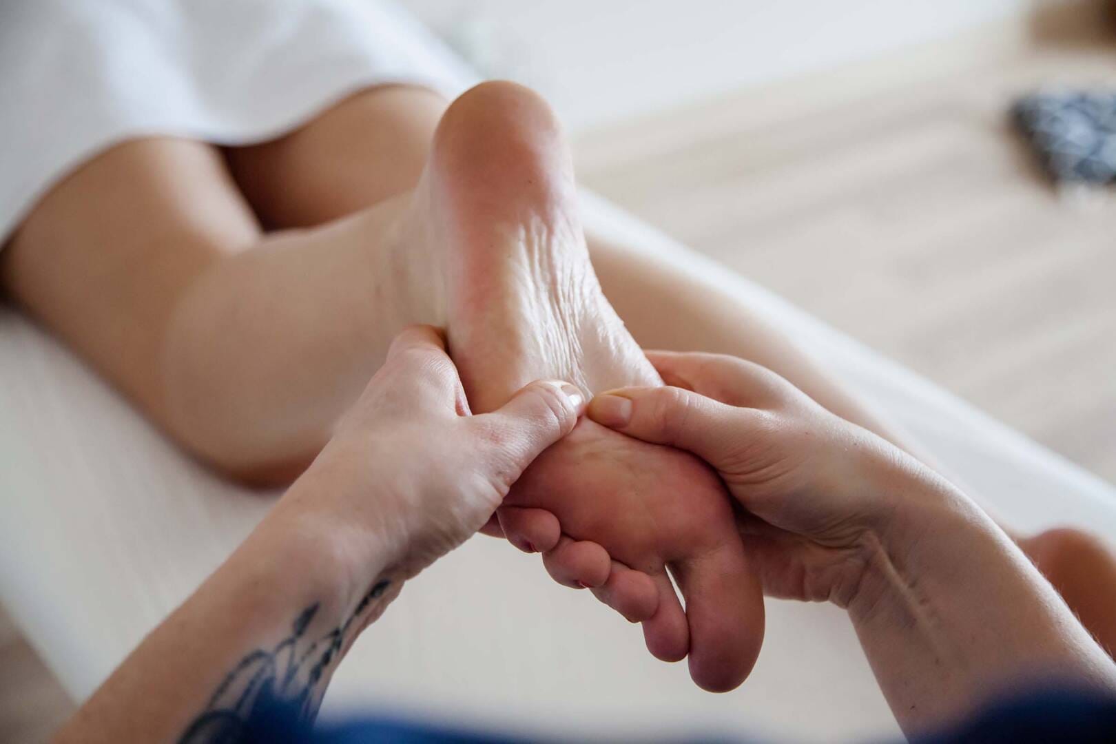 a professional spa employee performing peacefull foot massage