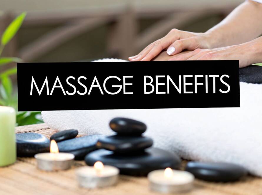 A massage table with white linens, rolled towels, and black stones in a warm treatment room with a "Find Your Calm" sign.